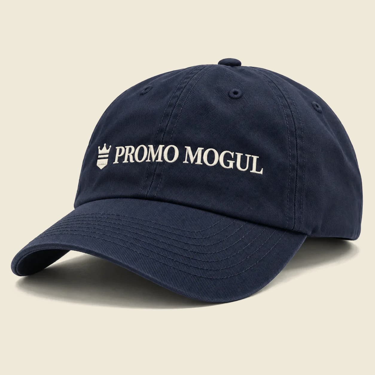 Navy blue dad hat with the PromoMogul logo embroidered on the front