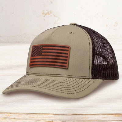 Custom leather patch trucker hat with engraved logo